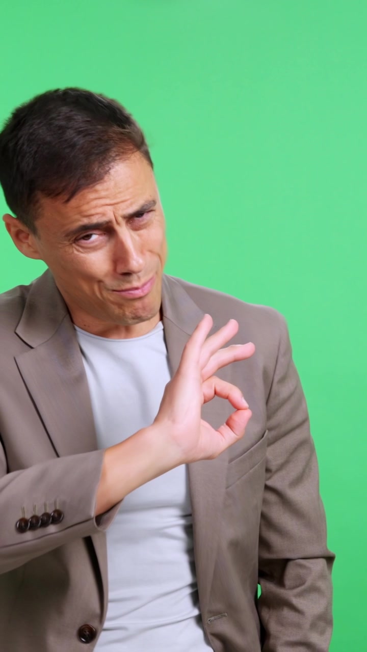 Expressive man presenting a concept on a green screen