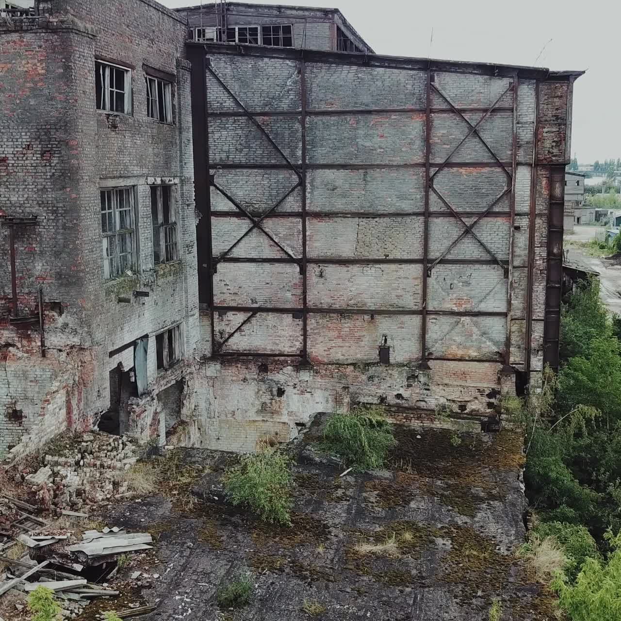 Aerial: Old Factory. Abandoned building exterior. Old factory building for demolition.