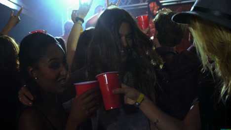 group of people dancing at a concert 4k