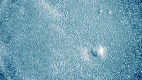 oxygen bubbles in water on a blue abstract background