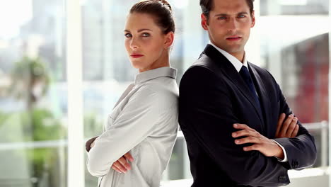 business people standing together back-to-back