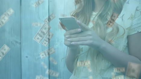 young woman using smartphone with floating dollar bills animation overlaid