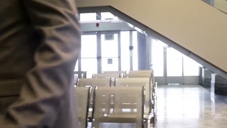 businessmen shaking hands in waiting area