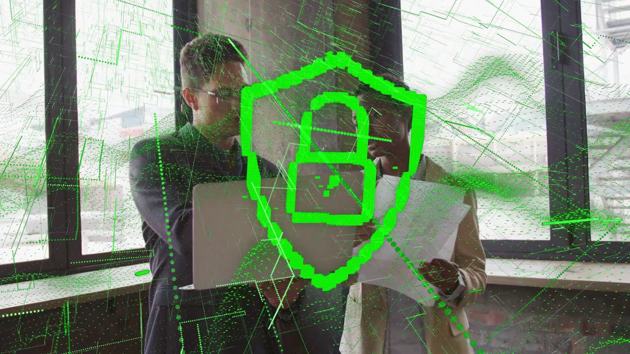 Business duo reviewing laptop and docs gesturing starting green shield padlock securing data