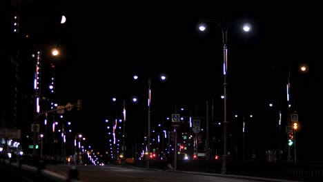 night cityscape with illuminated lamp posts