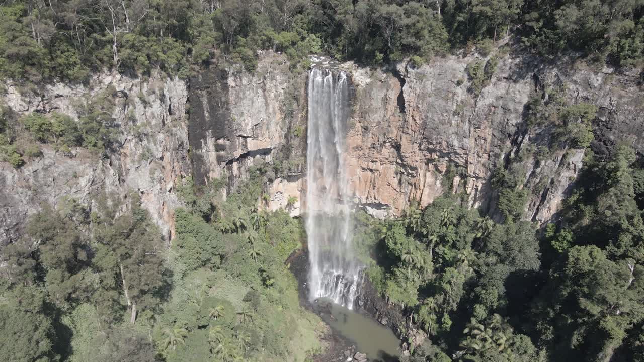 Stunning Aerial View of a Waterfall in Lush Forest