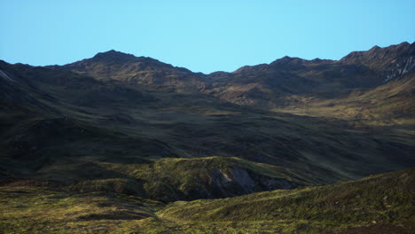 a view of a mountain range on a sunny day