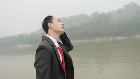 businessman by the river