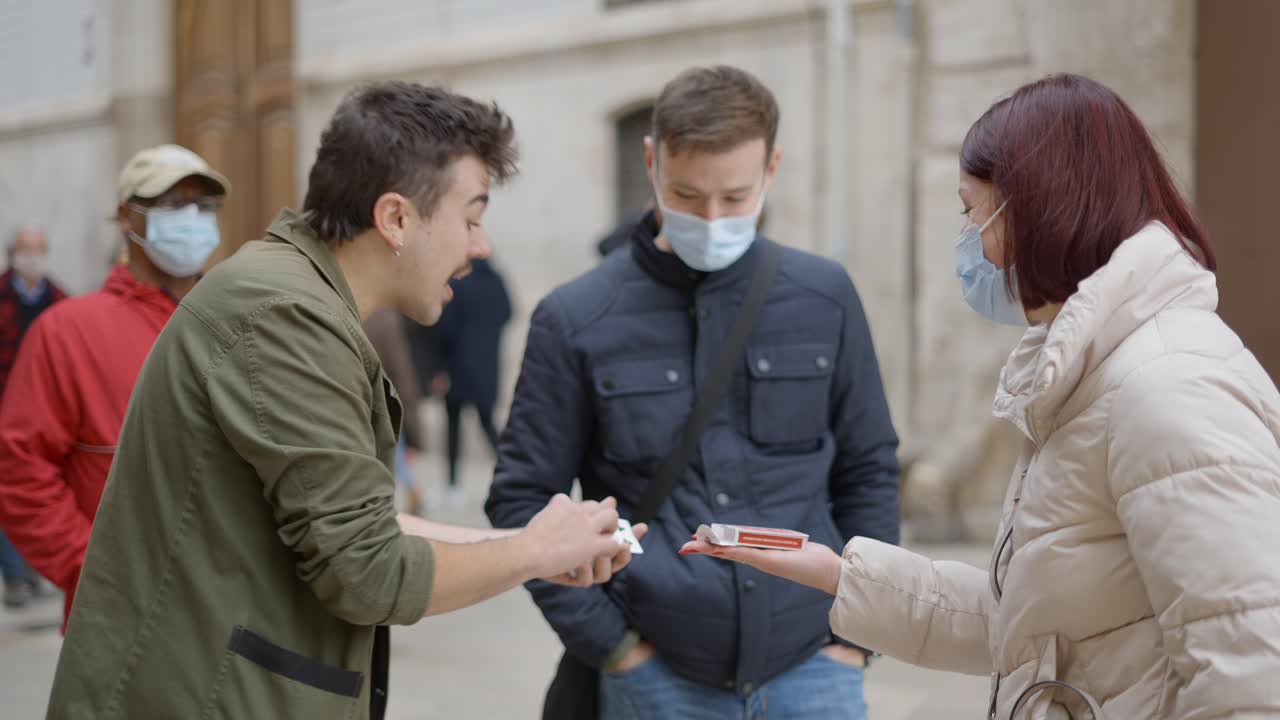 Street Magicians Performing Card Tricks