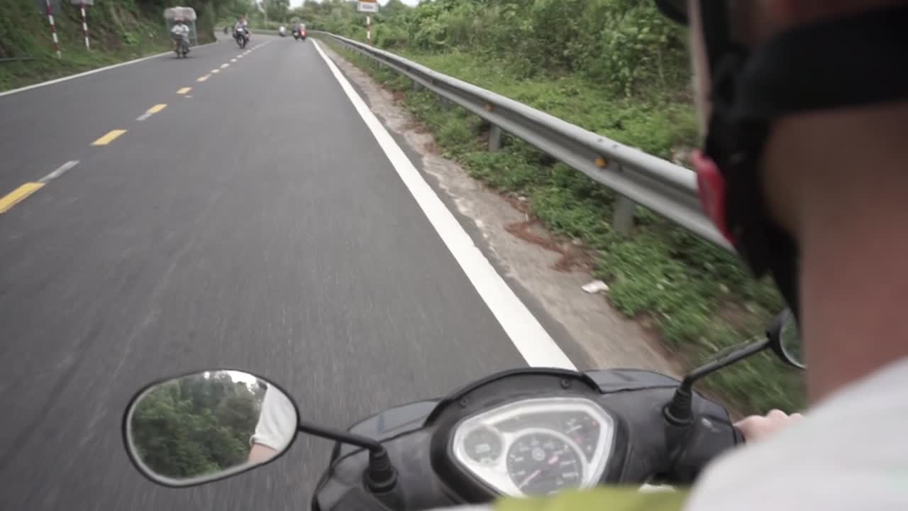 Tourist rented a moped on his travel in Asia