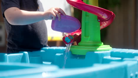 kid playing with toy slide