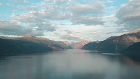 drone shot of a fjord in norway on a sunny day