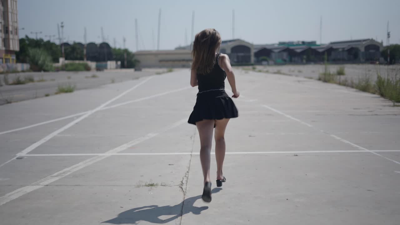 Woman Running in a Parking Lot