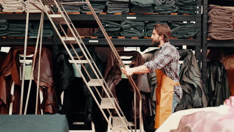 Fabric,-boutique-and-man-in-workshop-with-ladder