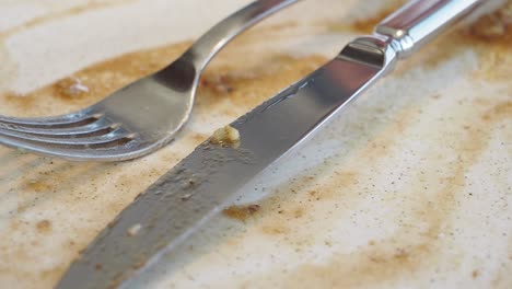 dirty plate with utensils