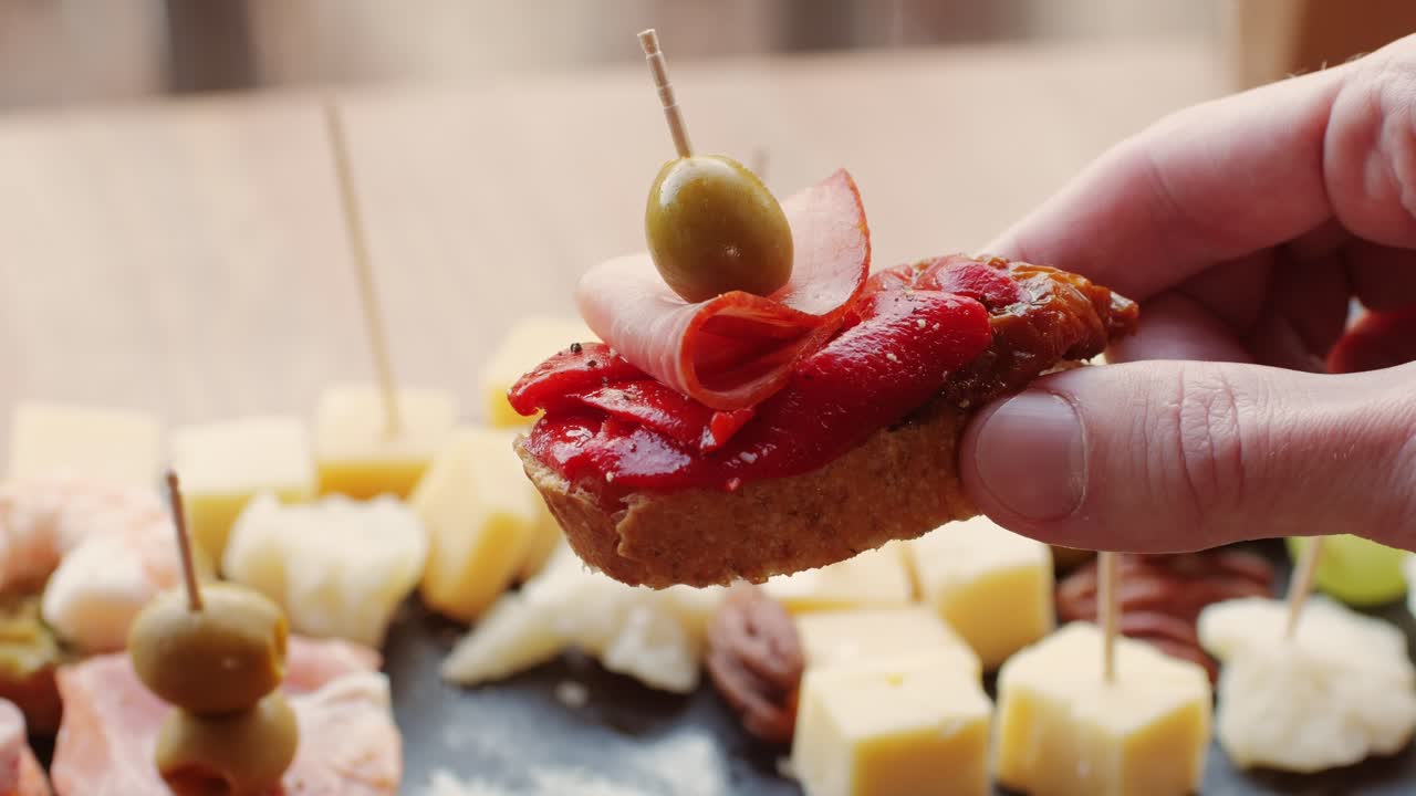 Hand holding a tapas