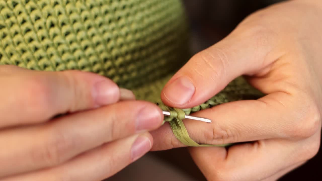 Crochets Close up. Woman Shows How To Knit Correctly