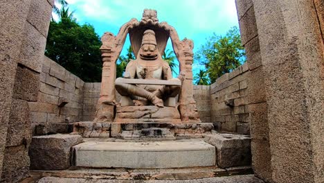 god-statue-ruins-antique-stone-art-from-flat-angle-at-morning