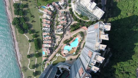 Hong-Kong-Cyberport-waterfront-park-luxury-residential-buildings,-Aerial-view