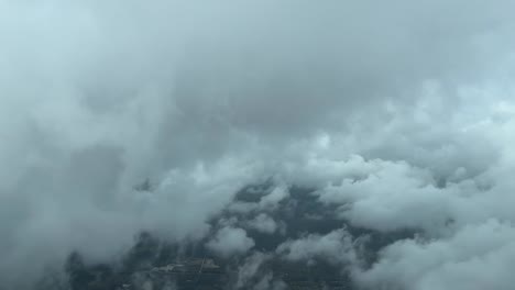 cockpit view flying through the clouds during an approach in a stormy sfternoon