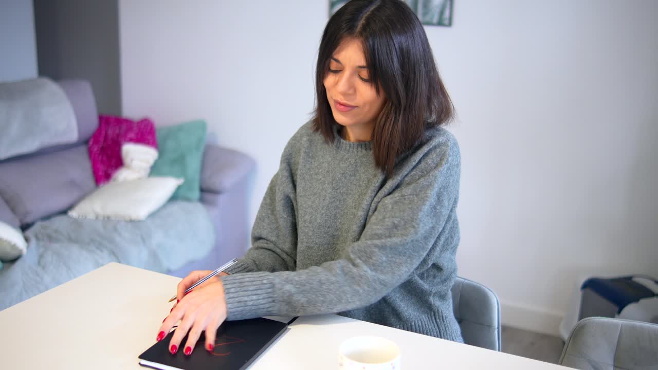 Woman journaling at home