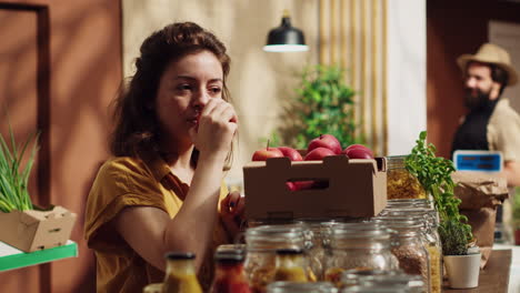 Woman-buys-farm-grown-store-apples