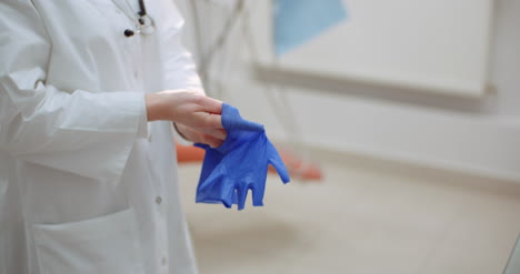 Close-Up-Of-Female-Scientist-Wearing-Gloves