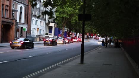 cars and pedestrians on a busy london street