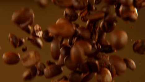 Falling-coffee-beans-on-the-brown-background-4k