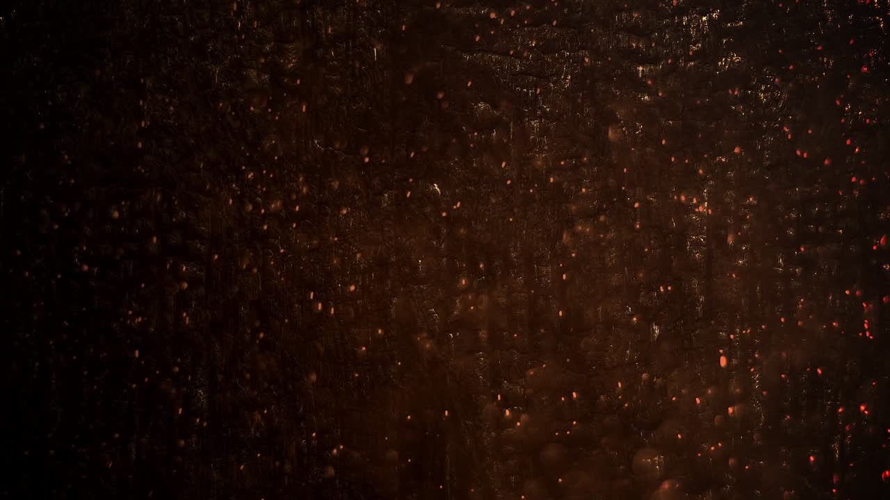 volar pequeños destellos dorados sobre la textura oscura de la piedra