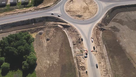 top down aerial view of a new traffic roundabout. construction business.