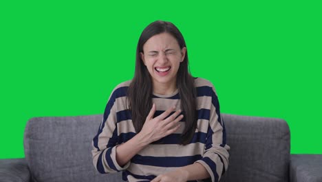 indian girl having an asthma attack green screen