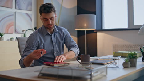 confident man start work at modern office closeup. businessman opening laptop