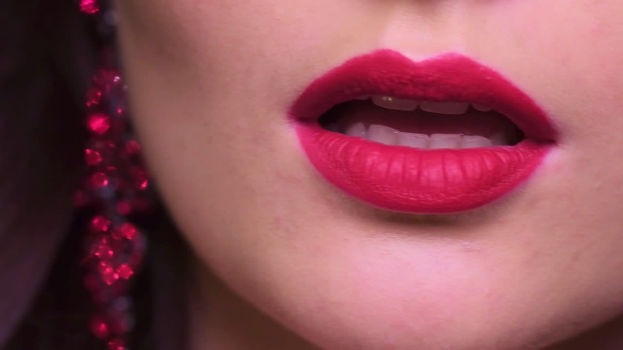A Close-Up Exploration of Luxurious Lip Color and Glamorous Accessories Showcasing Bold Beauty in Focus