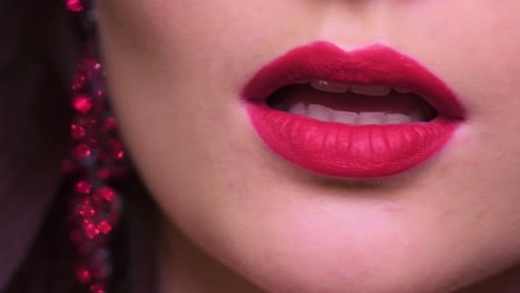 a close-up exploration of luxurious lip color and glamorous accessories showcasing bold beauty in focus