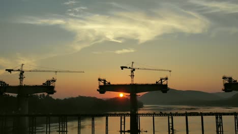 bridge construction at sunset