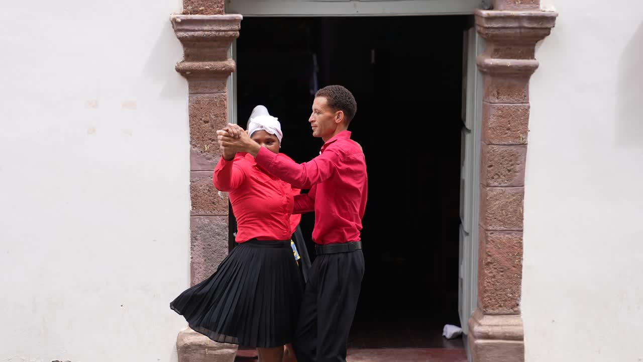Couple Dancing in Traditional Attire