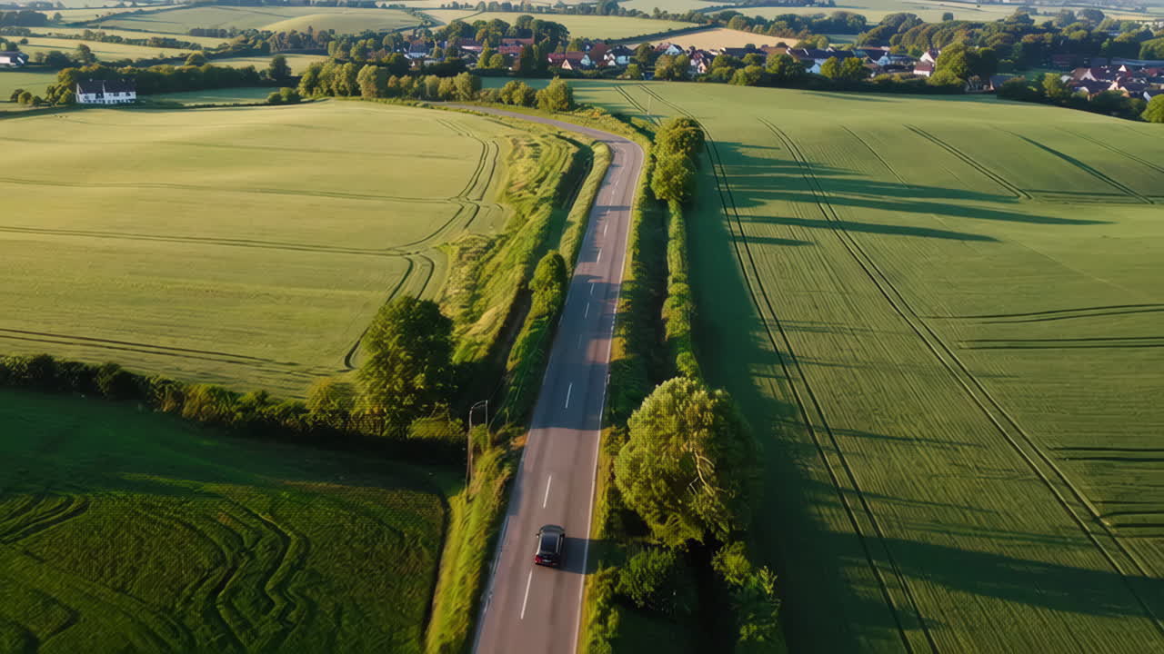 Aerial View of a Country Road through Fields and Villages