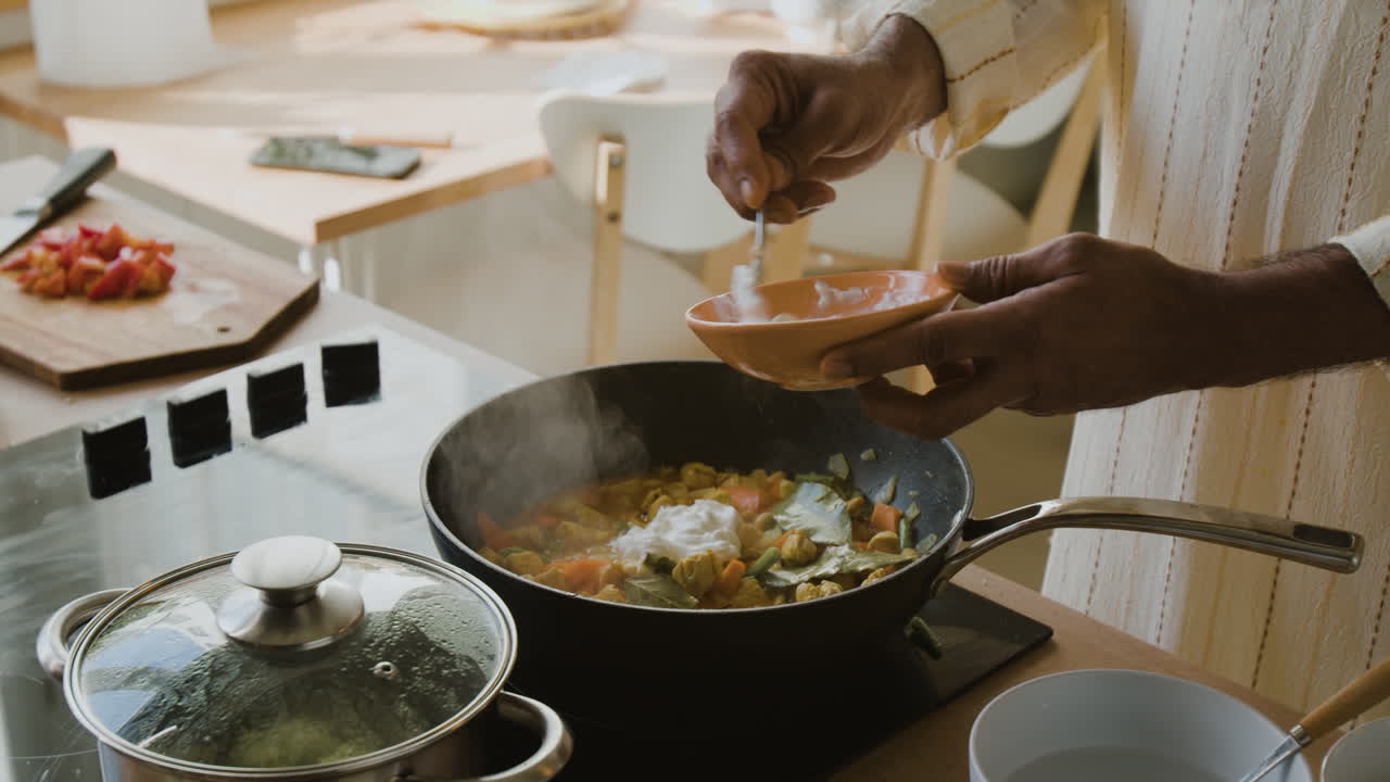 Cooking a delicious curry in a home kitchen