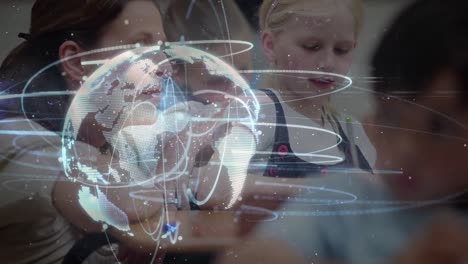 animation of globe of network of connections over female teacher and schoolgirl writing