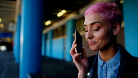 pink hair woman talking on mobile phone 4k