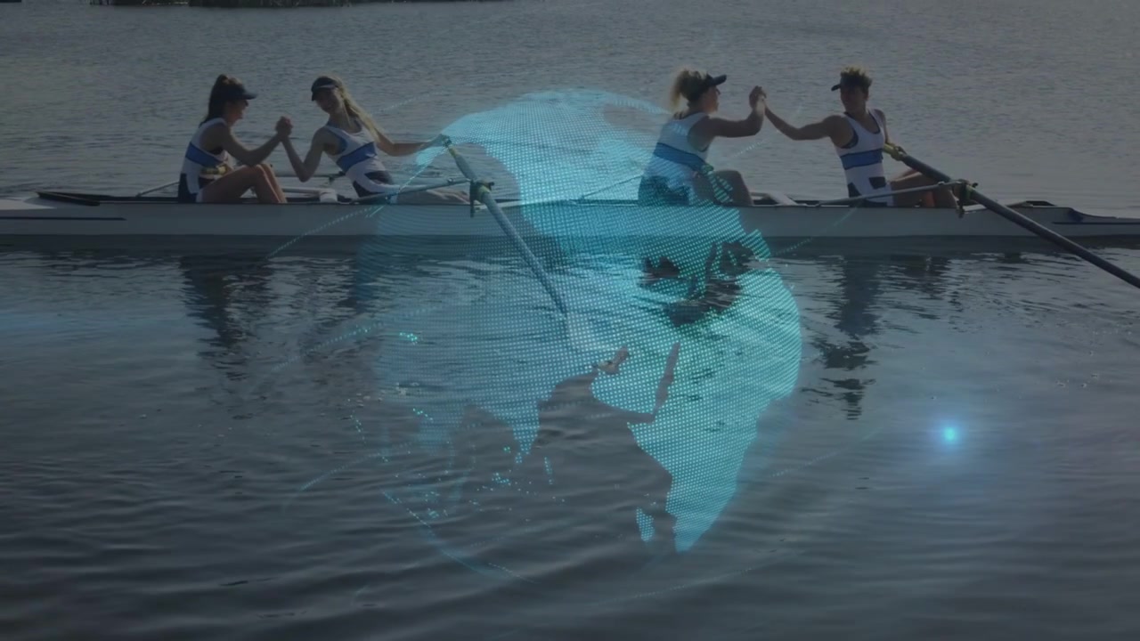 Four women sculling while oar ripples causing holo globe appearing, celebrating teamwork for sports
