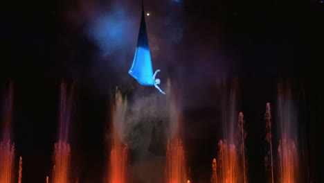 aerial performance on the stage with fountains