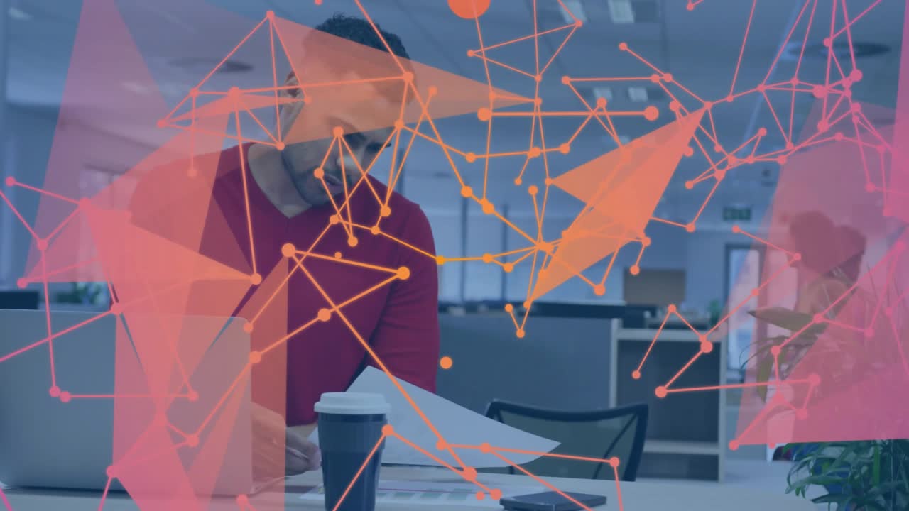 Man opening laptop initiating analytics overlay, reviewing documents as colleague walking past