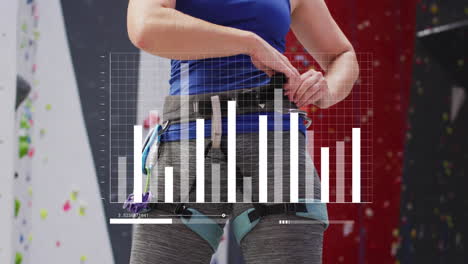 animation of data processing over caucasian woman climbing wall