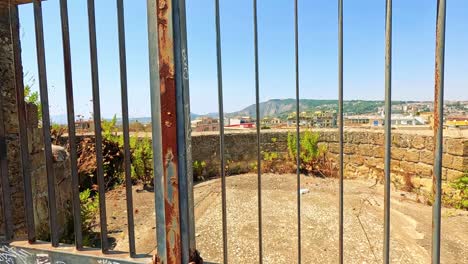 a panoramic view framed by iron bars