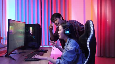 asian man and girl lose the video game