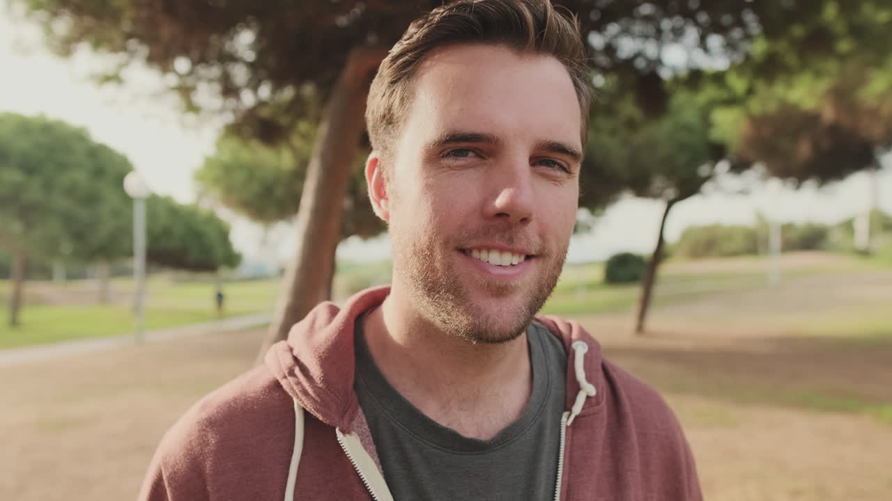 Portrait of a Man in a Hoodie Outdoors