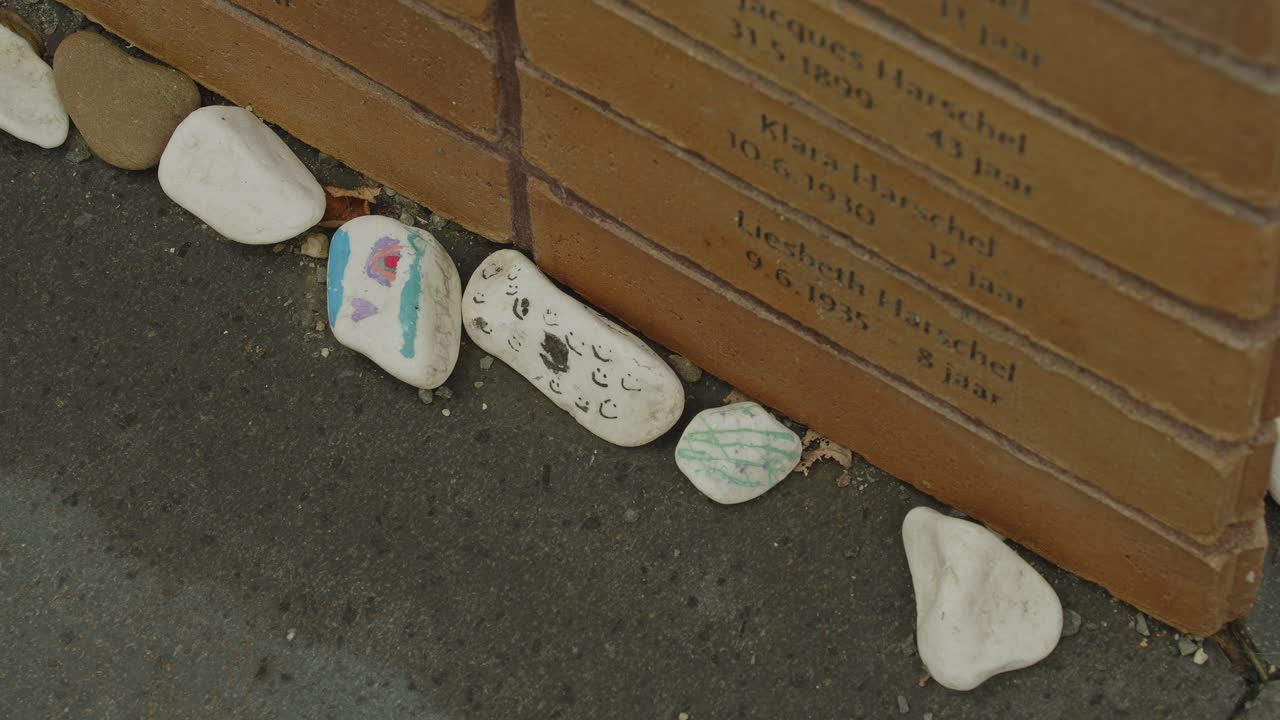High angle view of decorated commerative pebbles at National Holocaust Names Memorial in Amsterdam, the Netherlands