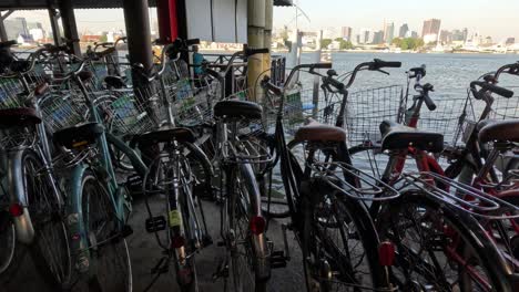 stationary view of bicycles parked by a river